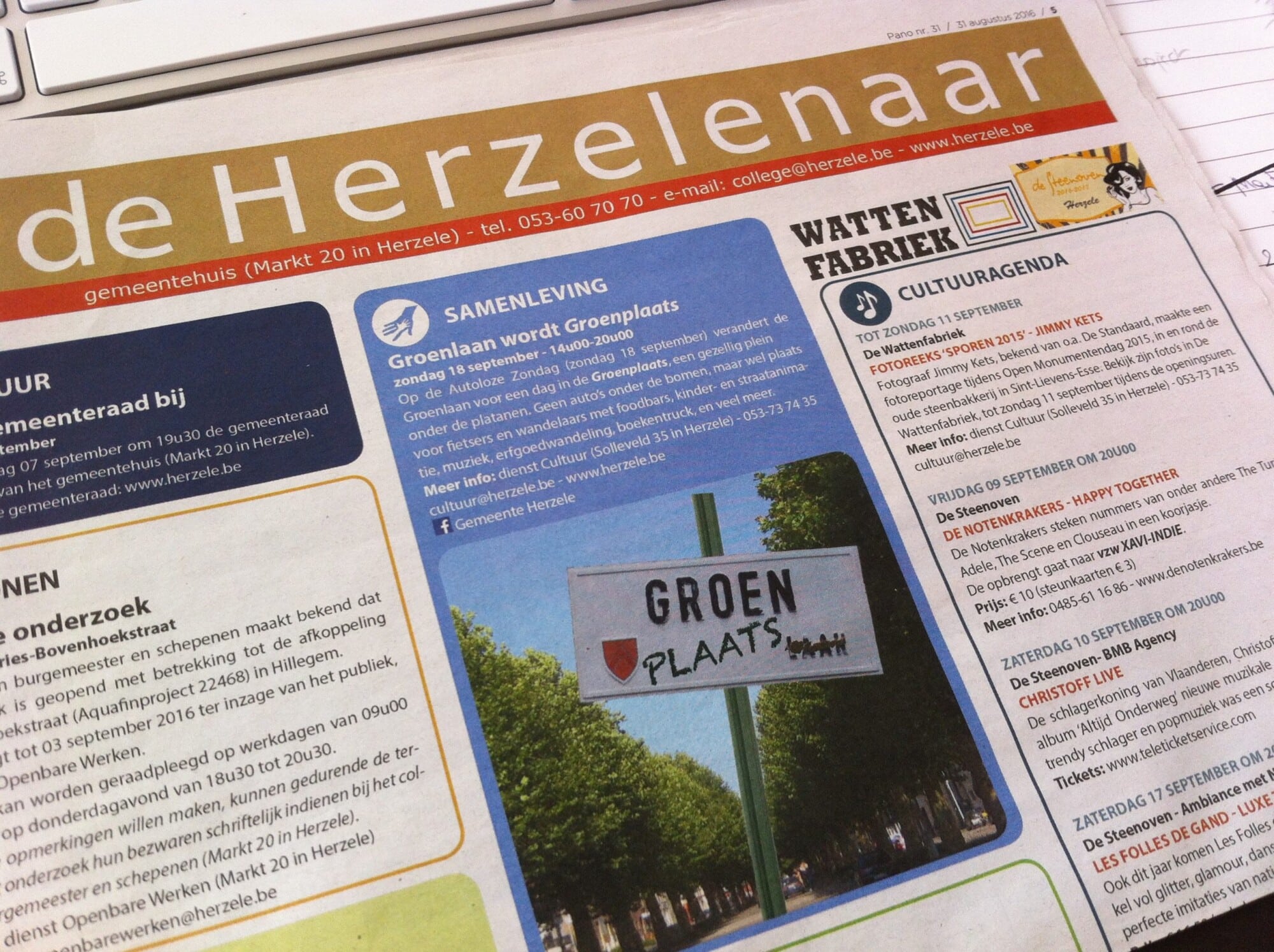 Dutch local newspaper "de Herzelenaar" featuring street sign "Groenplaats" and event listings for Sunday activities